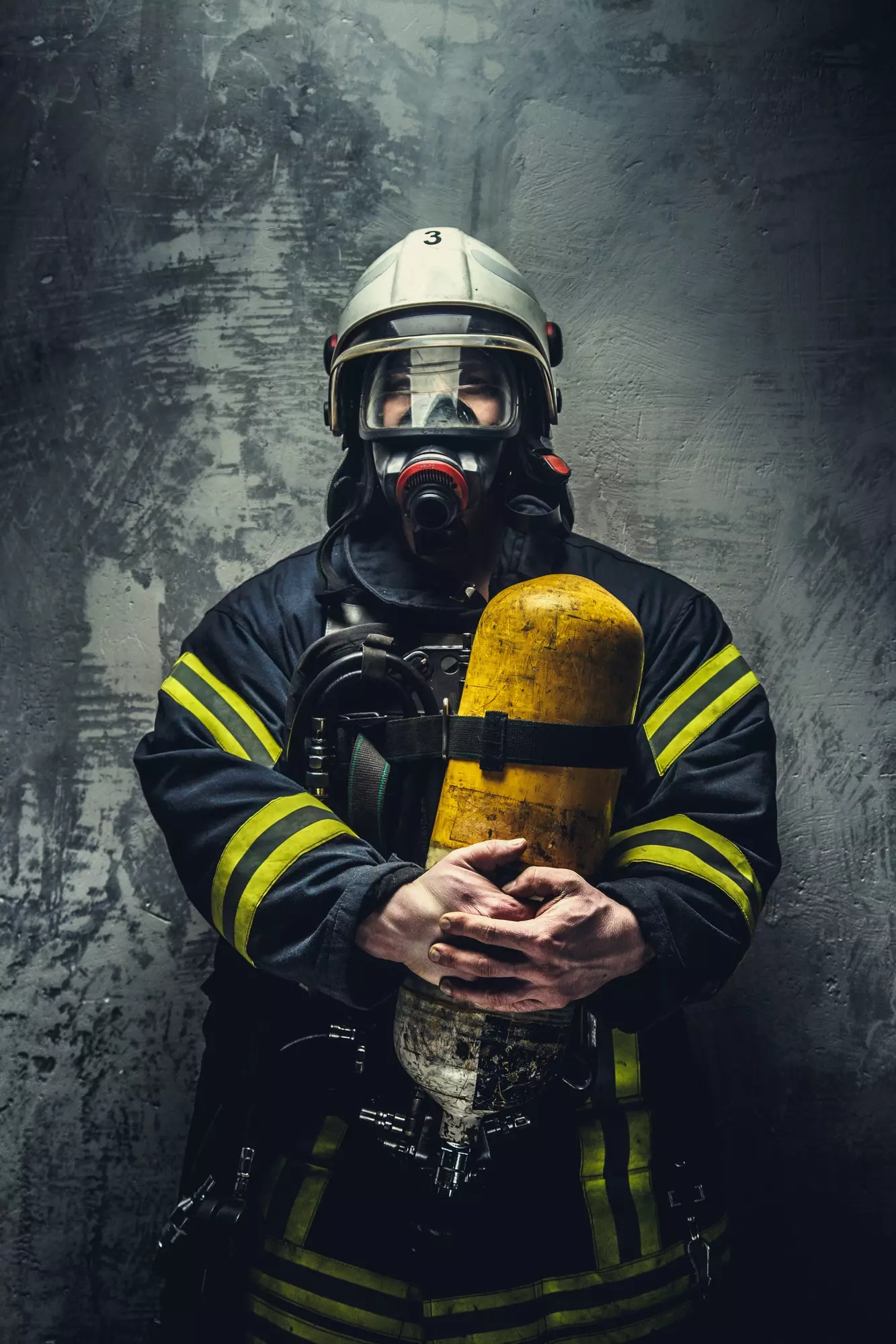 man holds extinguisher